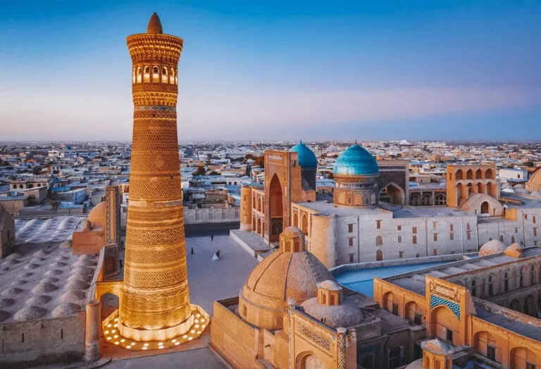 Historic minarets and domes of Bukhara at golden hour