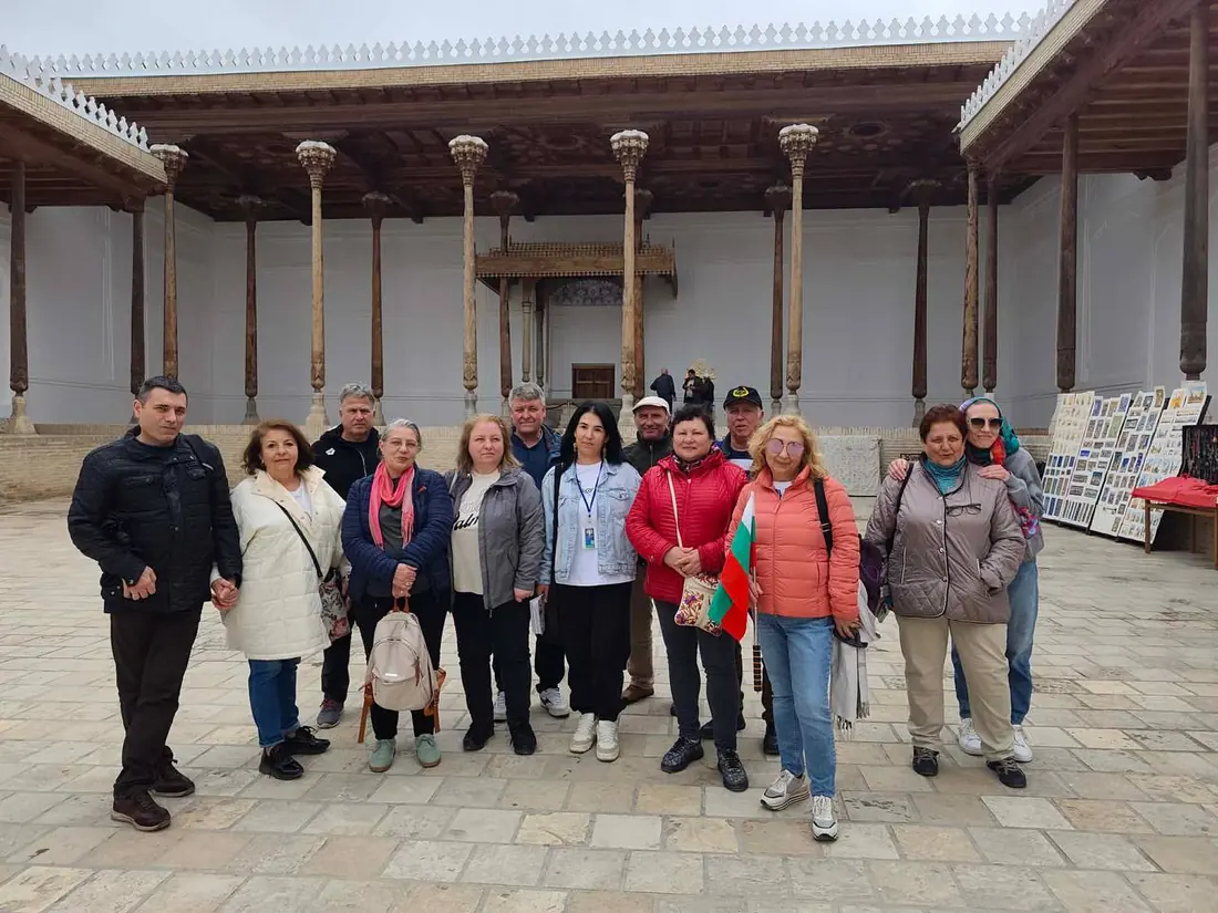 Group tour photo in the courtyard of Bolo Hauz mosque, Bukhara