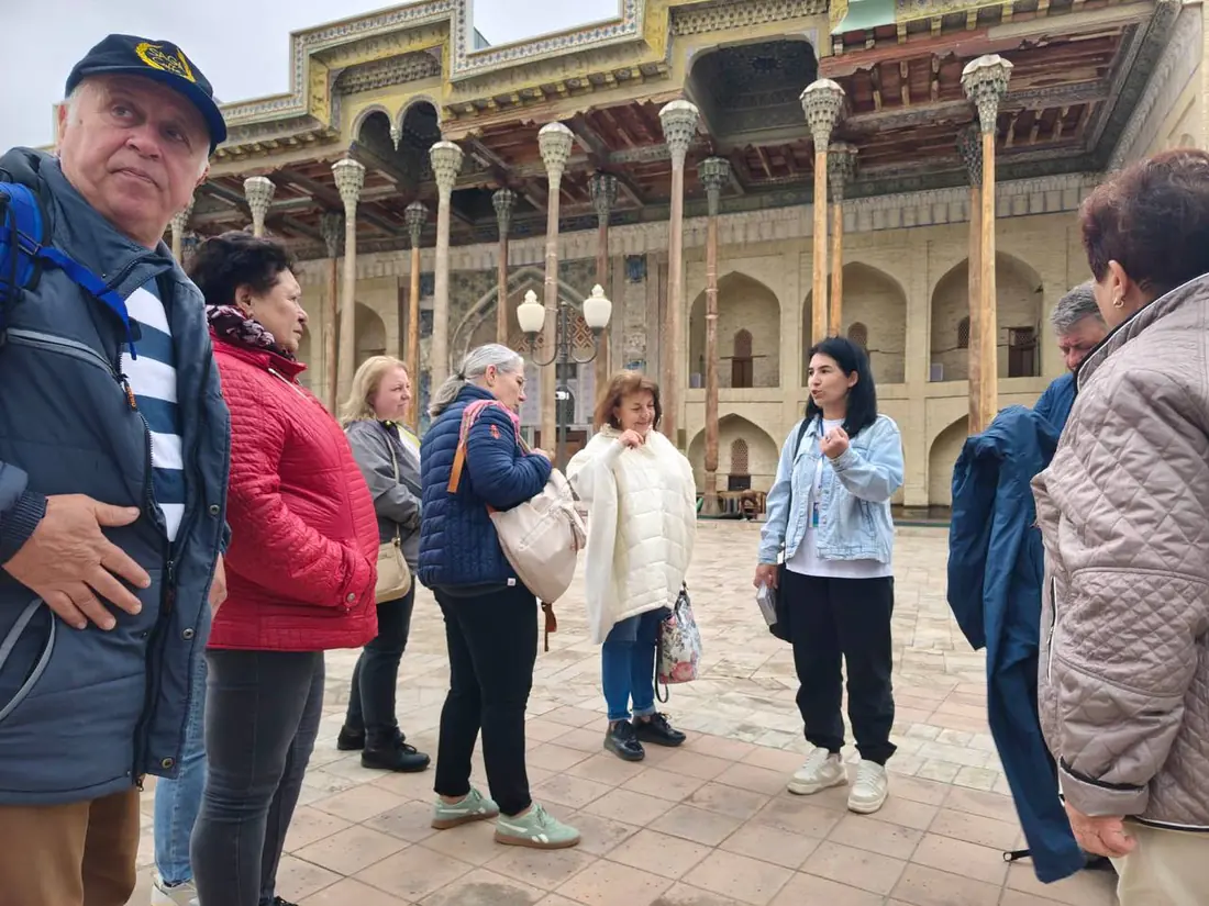 Group tour photo in the courtyard of Bolo Hauz mosque, Bukhara